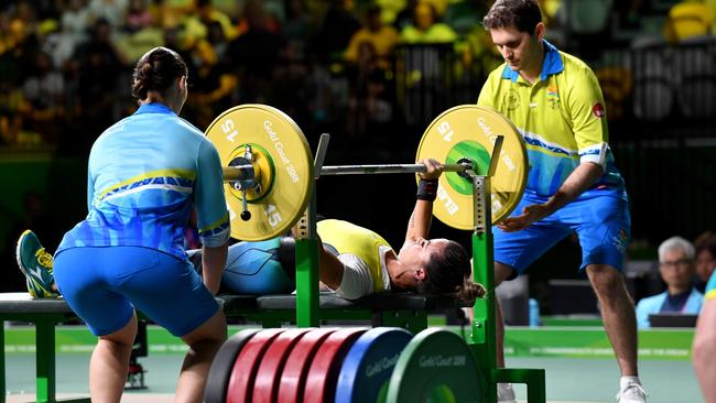 Kelly Cartwright on her way to yet another PB in para-powerlifting competition yesterday. Photo: AAP