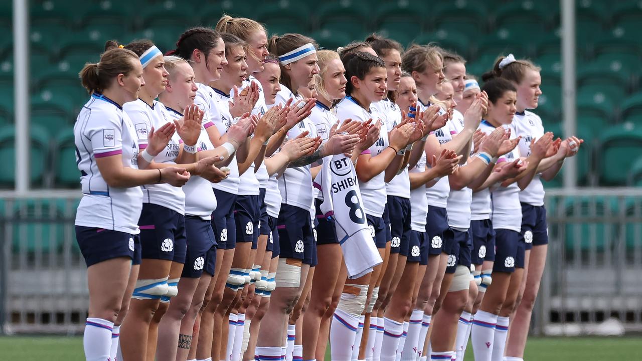 GLASGOW, SCOTLAND - APRIL 10: Scottish players take part in a minutes applause for former British Lion Tom Smith during the Scotland and France Women's Six Nations match at Scotstoun Stadium on April 10, 2022 in Glasgow, Scotland. (Photo by Ian MacNicol/Getty Images)