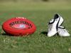 Generic AFL Sherrin football and football boots. sport /