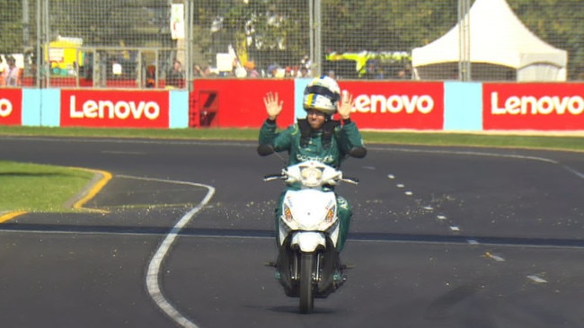 Vettel does a lap on his scooter