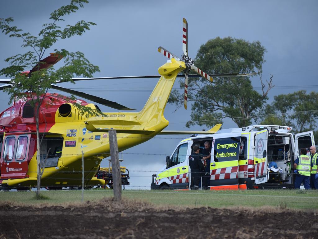 A man who suffered serious injuries after the red sedan Mitsubishi Lancer sedan he was driving crashed into a power pole on Rogans Bridge Rd north of Waterview Heights was transported by road ambulance to the Westpac Rescue Helicopter located in a nearby paddock on Thursday, 18th February, 2021. Photo Bill North / The Daily Examiner