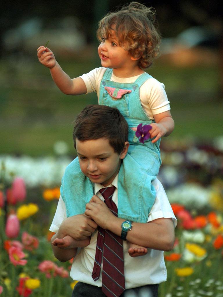 Nicholas (9yrs) plays with his sister Courtney (2yrs) at Queens Park in Toowoomba during Carnival of Flowers time. Picture: David Martinelli