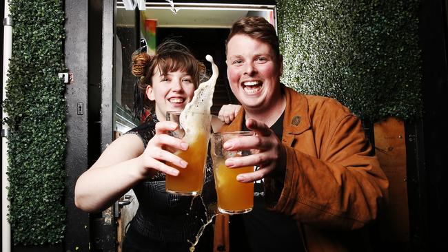 Twisted Lime bartender Jocelyn Greenwell and owner Joshua Wells cheers to reopening. Picture: Zak Simmonds