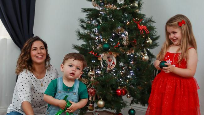 Anita Goncalves with her two children Rafael, 1, and Pia, 3, from Haberfield, getting prepared for Christmas this year. Picture: Justin Lloyd.