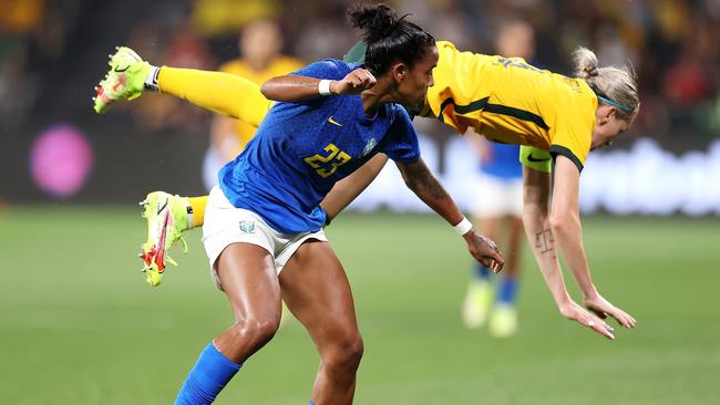 Alanna Kennedy of the Matildas falls over Geyse of Brazil.