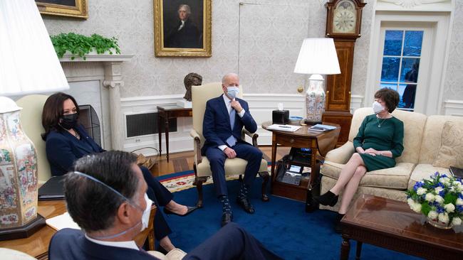 Joe Biden and Vice-President Kamala Harris meet Susan Collins and Mitt Romney in the Oval Office on February 1. Picture: AFP