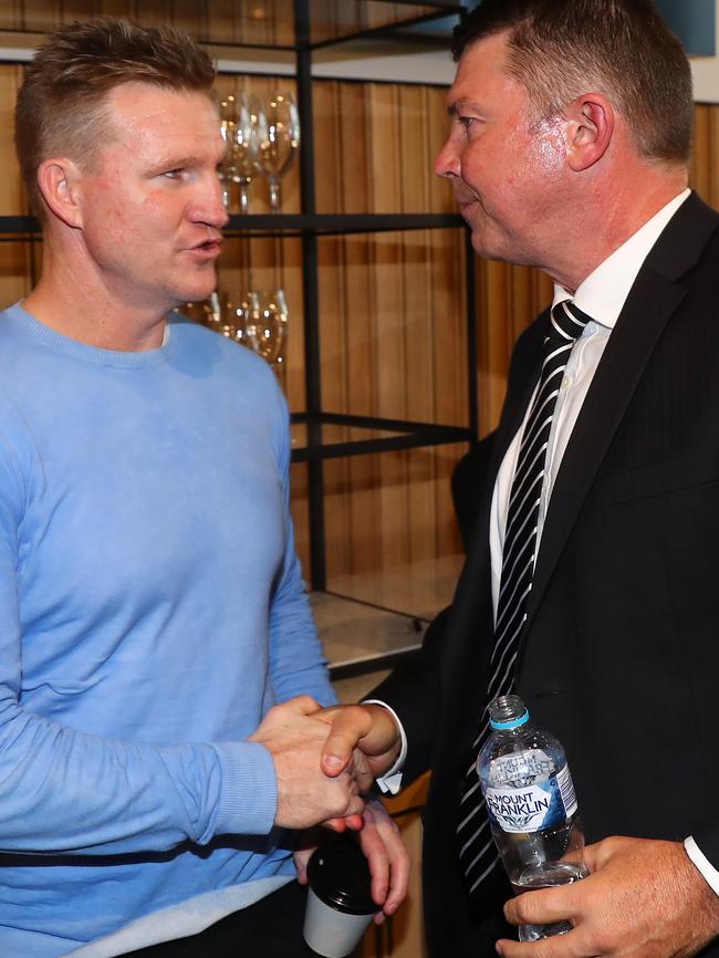 Buckley and Pert shake hands at the media conference. Picture: Michael Klein