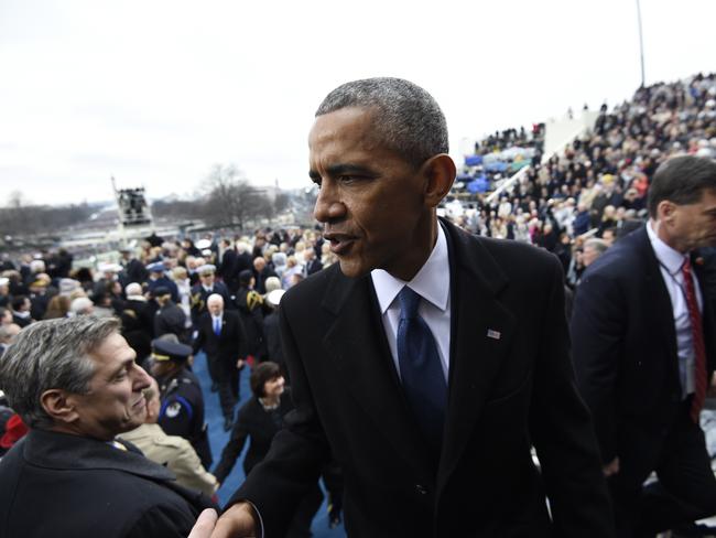 Former President Barack Obama shakes hands as he leaves Capitol Hill in Washington on January 20, 2017, after the Presidential Inauguration of Donald Trump. Picture: AP