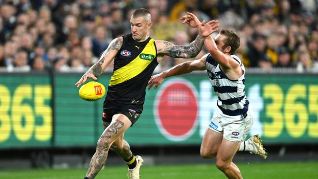 Geelong’s Tom Atkins chase Tiger star Dustin Martin on Friday night in round 9 last year. Picture: Quinn Rooney/Getty Images