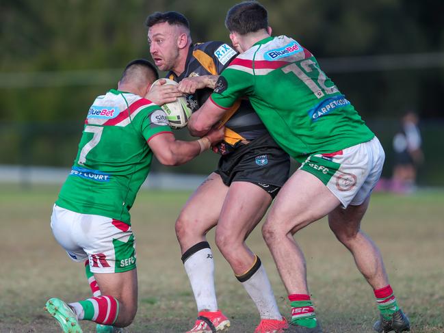 Liam Balzan tackled by Cooper Steven and Taine Woodford. Picture: Adam Wrightson Photography