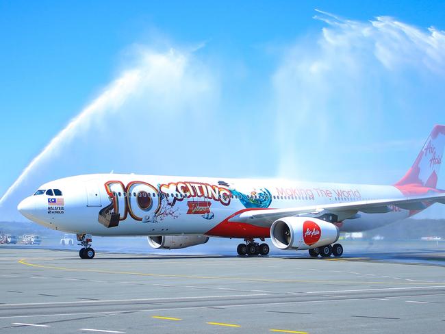 AirAsia X marked its 10 year birthday with a specially decorated Airbus flight into the Gold Coast from Kuala Lumpur this morning, October 26. The plane was greeted with a fire service water tower celebration on the tarmac at Gold Coast Airport.