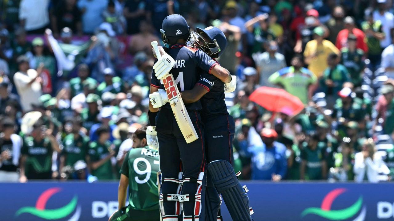 USA's Vice Captain Aaron Jones (R) and Nitish Kumar celebrate after scoring and bringing the game to a super over. Photo by ANDREW CABALLERO-REYNOLDS / AFP.