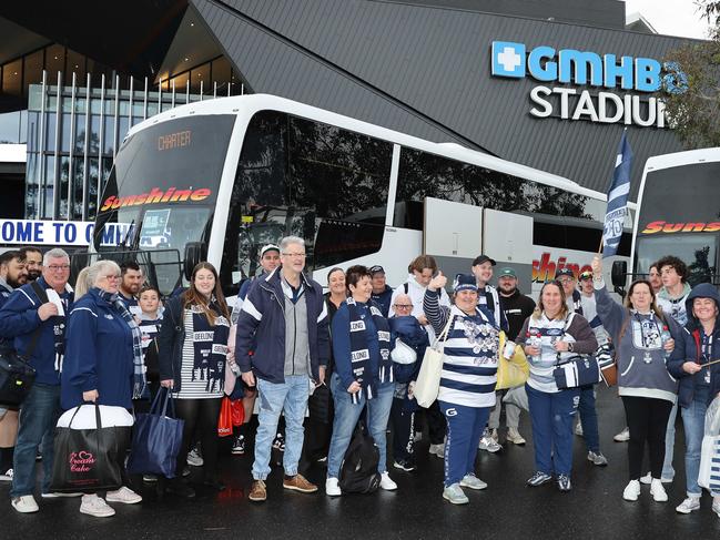 Cats fans prepare to leave Kardinia Park in a bus convoy to South Australia. Picture: Alison Wynd