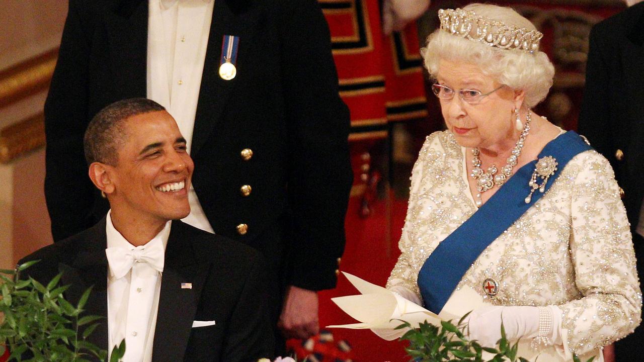 Queen Elizabeth talking as the then US President Barack Obama looks on during a state banquet at Buckingham Palace in 2011. Picture: AFP