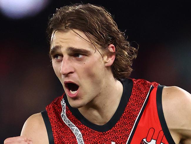 MELBOURNE, AUSTRALIA - MAY 19: Harrison Jones of the Bombers celebrates kicking a goal during the round 10 AFL match between Essendon Bombers and North Melbourne Kangaroos at Marvel Stadium, on May 19, 2024, in Melbourne, Australia. (Photo by Quinn Rooney/Getty Images)