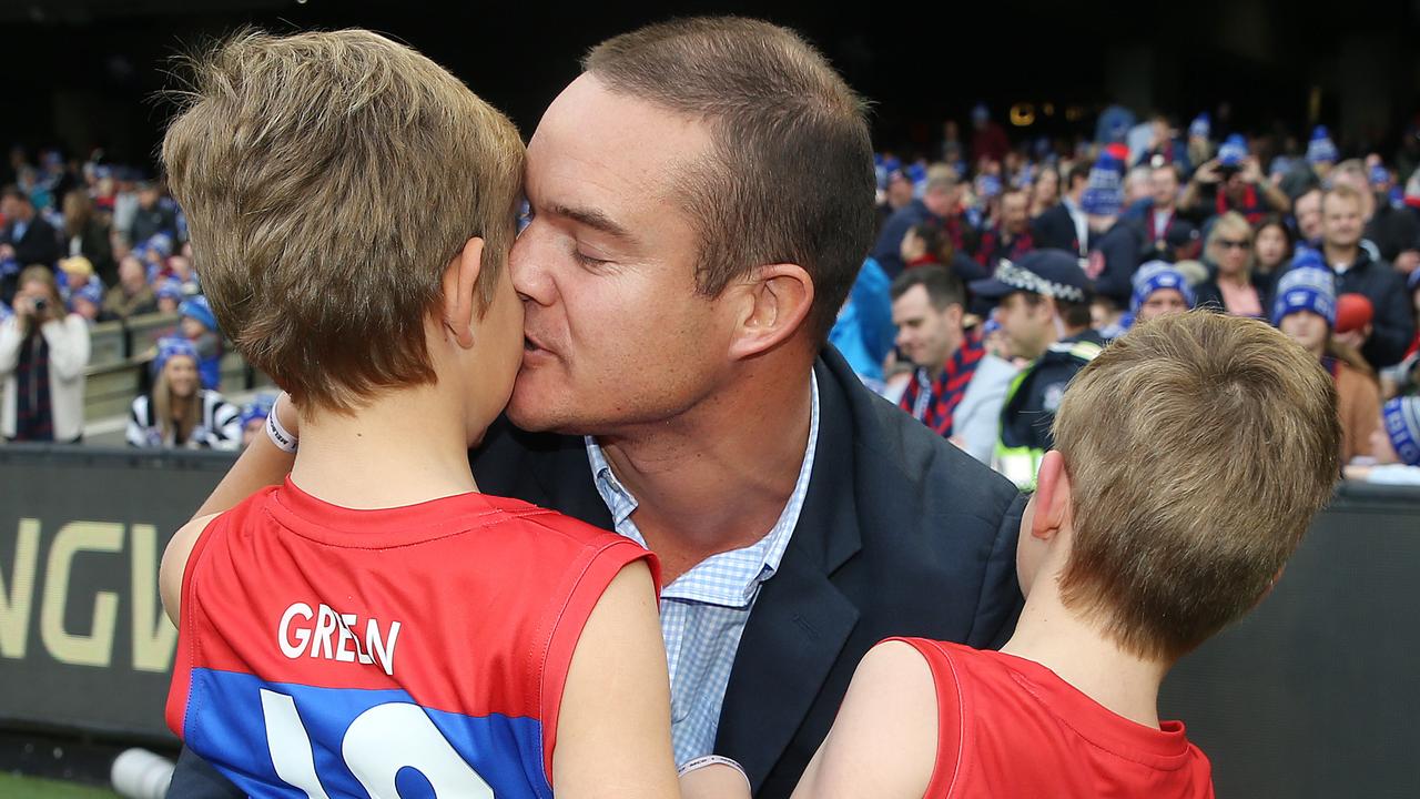 AFL Round 12. 10/06/2019. Big Freeze 5. Collingwood vs Melbourne at the MCG. Brad Green kisses his son Wilba and hugs Oliver after lead the Demons onto the MCG in honour of their mother Anna who passed recently  .  Pic: Michael Klein