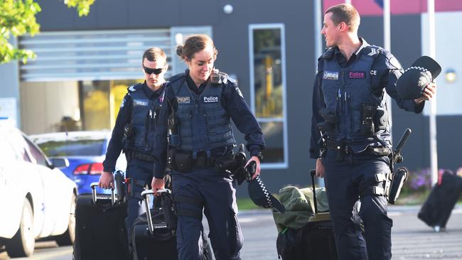 Dozens of police leave the Parkville youth jail following unrest in November. Picture: Tony Gough