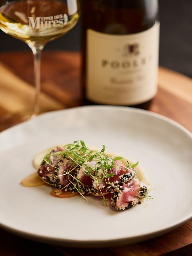 The second course of the special Southern Bluefin dinner features a tataki tuna fillet, with a black and white sesame crust, cauliflower puree, ginger pickled apple and radish. Picture: Samuel Shelley