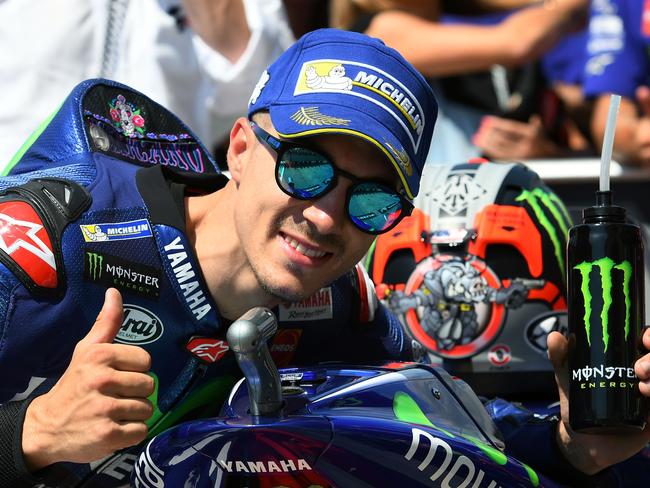 Yamaha's Spanish rider, Maverick Vinales, celebrates his pole position.