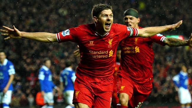 LIVERPOOL, ENGLAND - JANUARY 28: Steven Gerrard of Liverpool celebrates after scoring the opening goal during the Barclays Premier League match between Liverpool and Everton at Anfield on January 28, 2014 in Liverpool, England. (Photo by Laurence Griffiths/Getty Images)