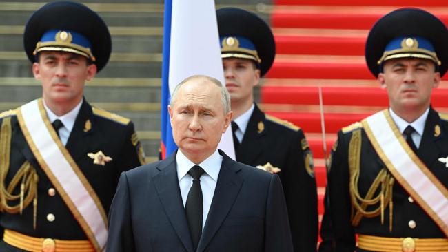 Vladimir Putin holds a minute of silence for pilots killed in clashes with the Wagner mercenaries during their rebellion. Picture: AFP.