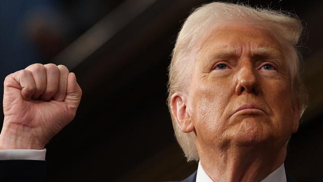 US President Donald Trump raises his fist as he addresses a joint session of Congress at the US Capitol in Washington, DC, on March 4, 2025. (Photo by Win McNamee / POOL / AFP)