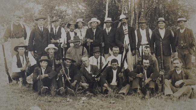 The photo – which Mr Staatz believes dates back to the early 1900s – depicts a group of well-dressed men posing with rifles.