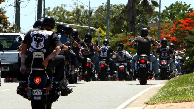 Bikies from the Black Uhlans and Nomads roar through a Gold Coast suburb.