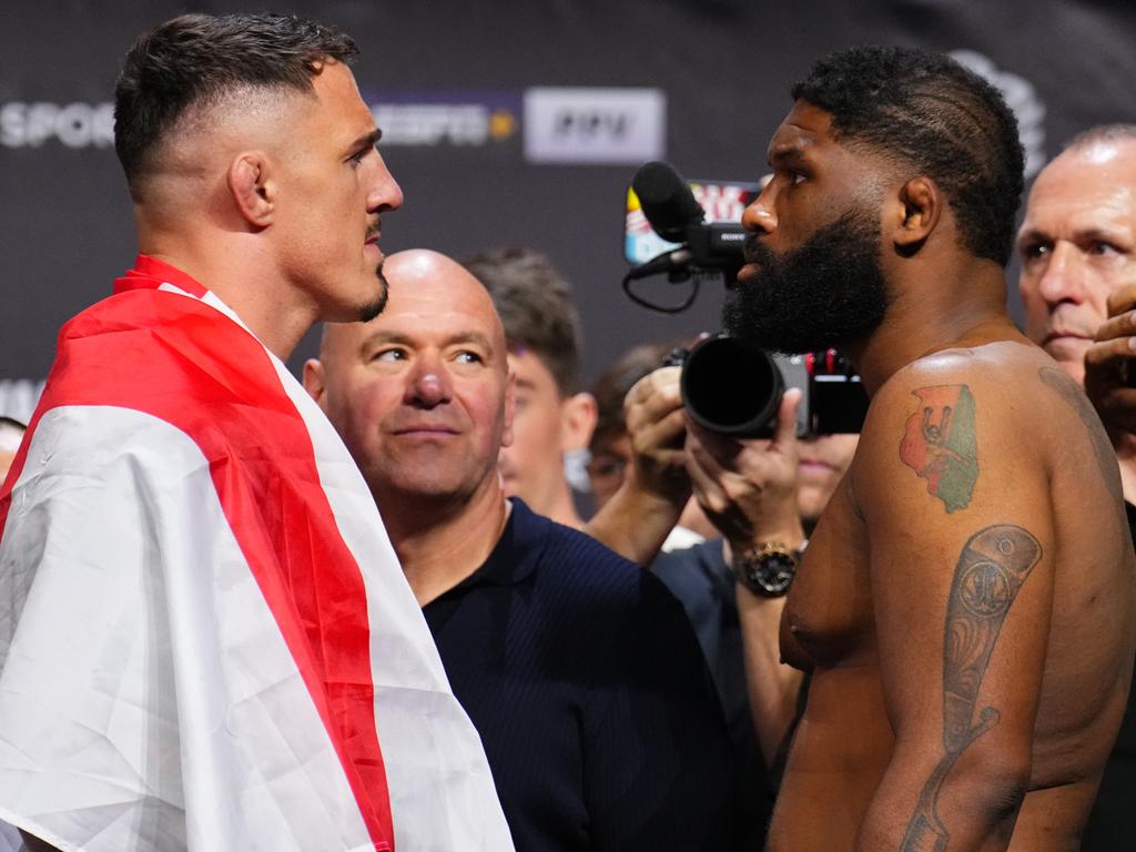 Aspinall (L) and Blaydes (R) agree the winner of their fight should be considered the true heavyweight champ. Chris Unger/Zuffa LLC via Getty Images