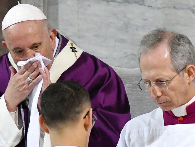 Pope Francis wipes his nose during the Ash Wednesday mass which opens Lent, the forty-day period of abstinence and deprivation for Christians before Holy Week and Easter. Picture: AFP