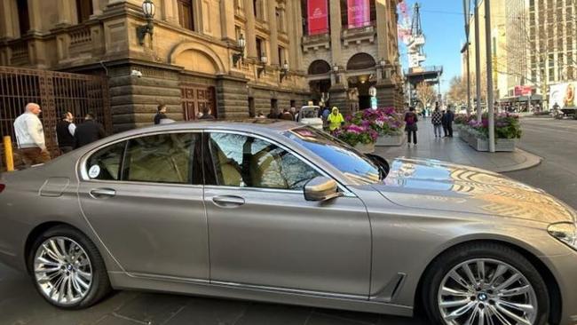 A chauffeur-driven BMW parked on the footpath outside Melbourne Town Hall on August 8, 2023