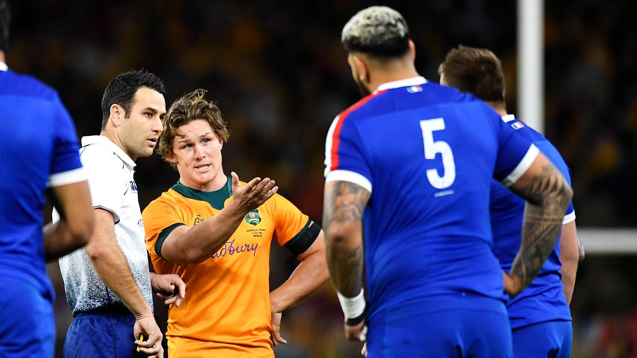 Michael Hooper talks with Ben O’Keeffe after Marika Koroibete was shown a red card. Photo: Getty Images