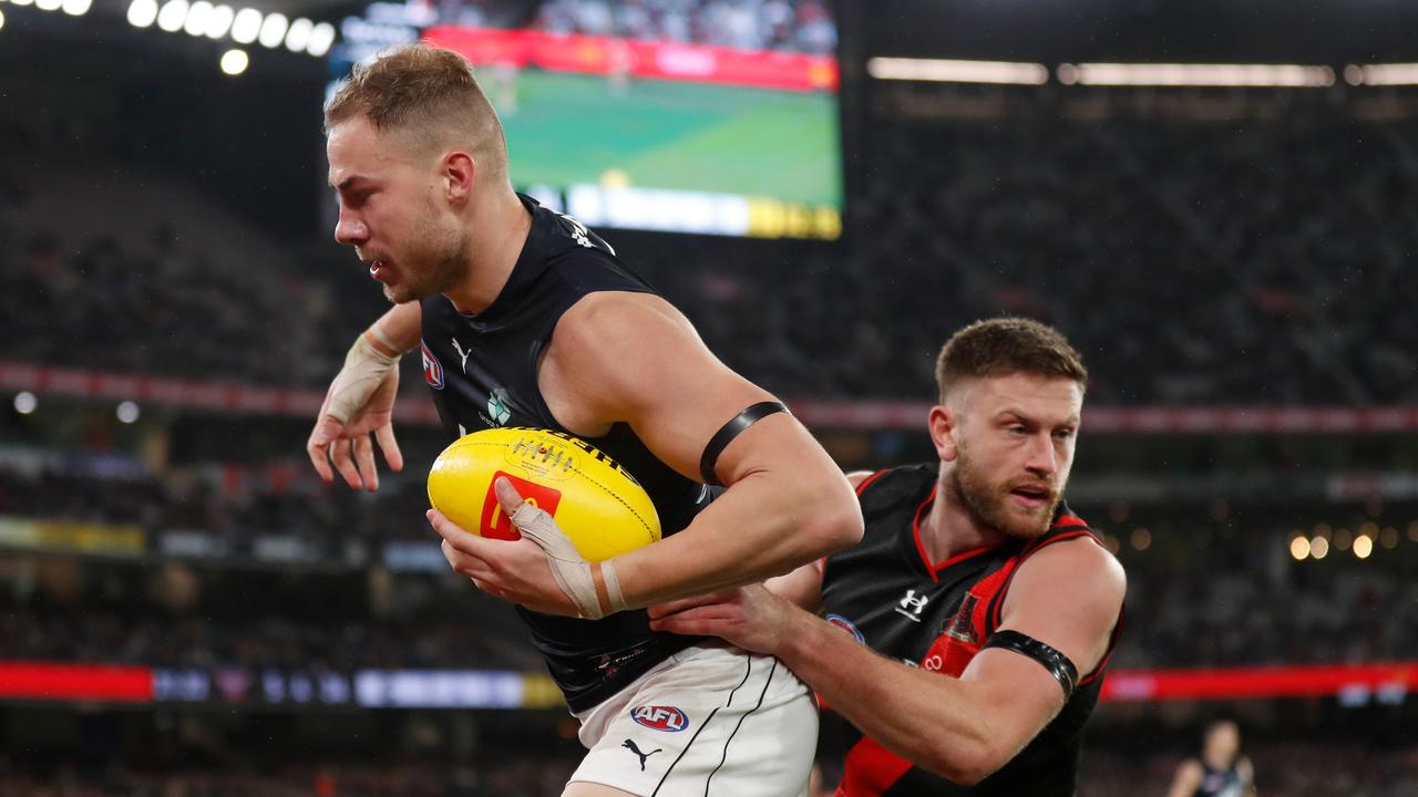 Harry McKay of the Blues is tackled by Jayden Laverde of the Bombers. (Photo by Michael Willson/AFL Photos via Getty Images