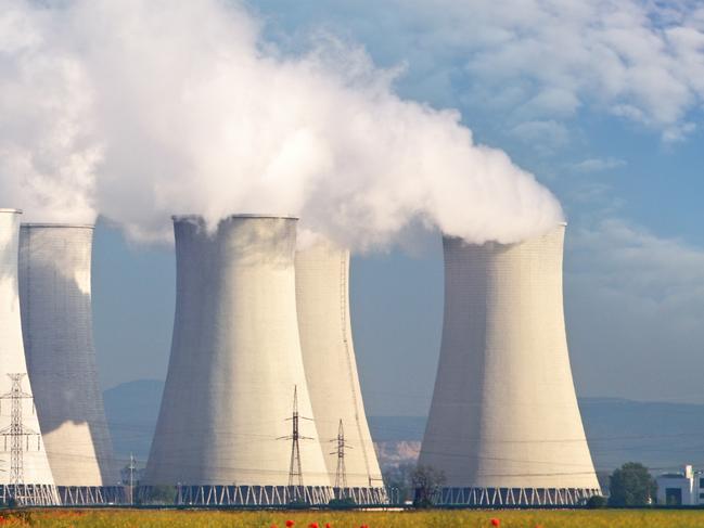 Nuclear Power plant with red field and blue sky