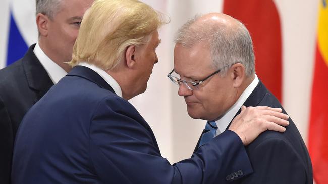 US President Donald Trump and Australian Prime Minister Scott Morrison share some quiet words in Osaka last month. Picture: Getty Images