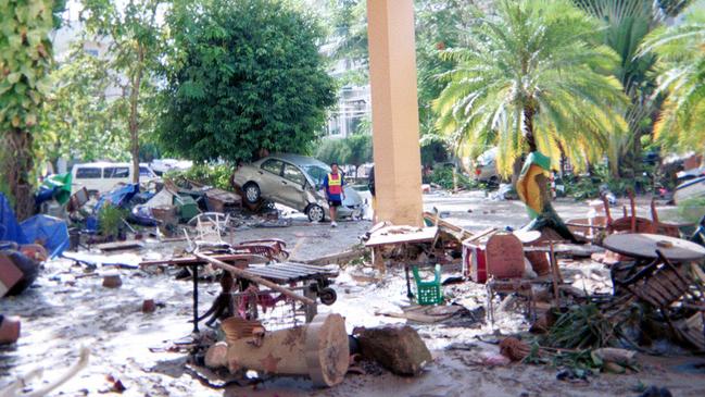 Debris littered the streets in the days after the tsunami. Picture: Stephen Carroll