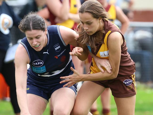 Caulfield Ella Baxter (left) will pull on a Big V jumper on July 15. Picture: Hamish Blair