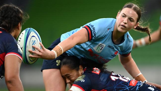 Caitlyn Halse passes the ball during the Super W match between Melbourne Rebels Women and NSW Waratahs Women. Picture: Quinn Rooney/Getty Images