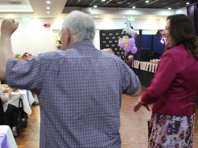 The crowd cheered as Premier Annastacia Palaszczuk entered the room.