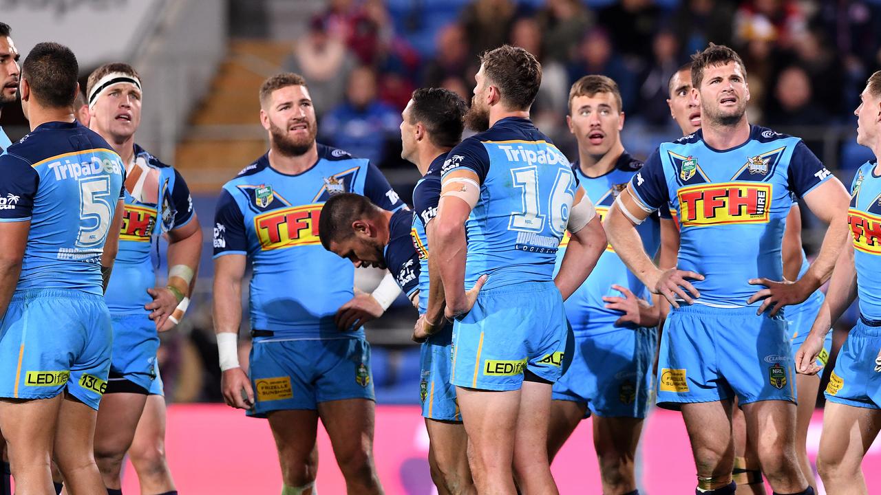 Titans players look on following a Roosters try during the Round 18 NRL match between the Gold Coast Titans and the Sydney Roosters at Cbus Super Stadium on the Gold Coast, Sunday, July 15, 2018. (AAP Image/Dave Hunt)