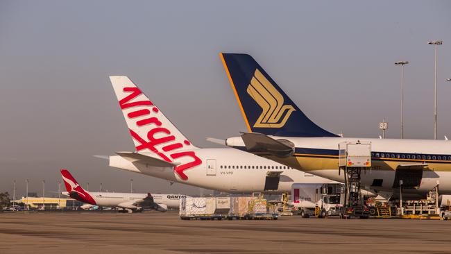 Planes at Brisbane Airport. Noise levels across the western suburbs will change once the second runway opens next year.