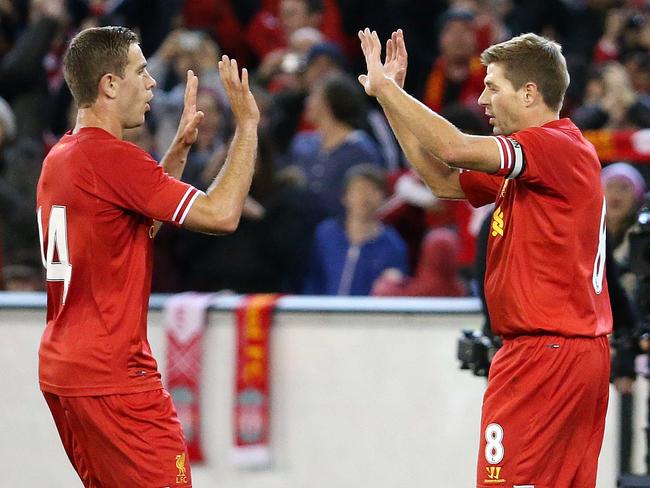 Melbourne Victory v Liverpool FC at the M.C.G., Liverpool's Steven Gerrard celebrates his goal in the first half with Jordan Henderson.