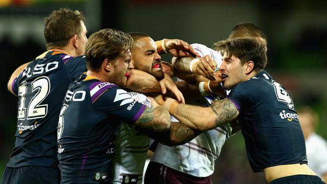 MELBOURNE, AUSTRALIA - MAY 19:  Players wrestle during the round 11 NRL match between the Melbourne Storm and the Manly Sea Eagles at AAMI Park on May 19, 2018 in Melbourne, Australia.  (Photo by Robert Prezioso/Getty Images)