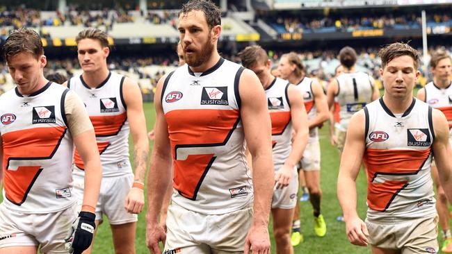 GWS players leave the MCG after another loss. Picture: AAP Images