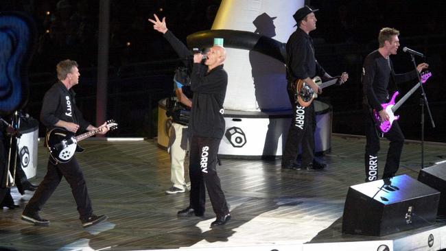 Peter Garrett and Midnight Oil say ‘Sorry’ at the closing ceremony of the 2000 Sydney Olympics.