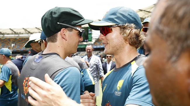 Will Pucovski (right) congratulates Jhye Richardson on receiving his baggy green cap before the first Test at the Gabba last week. Picture: Getty Images