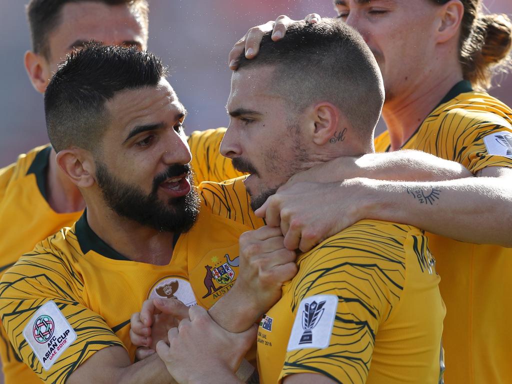 DUBAI, UNITED ARAB EMIRATES - JANUARY 11:  Jamie Maclaren of Australia celebrates with mates after scoring their team's first goal during the AFC Asian Cup Group B match between Palestine and Australia at Rashid Stadium on January 11, 2019 in Dubai, United Arab Emirates. (Photo by Francois Nel/Getty Images)