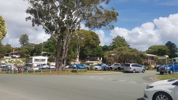 Cars parked on the median strip at Weinam Creek ferry terminal near the site of a new satellite hospital.