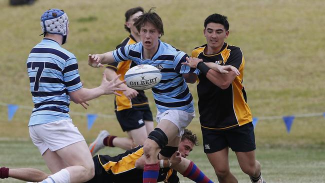 GPS II's's Austin Durbidge gets the ball away toward teammate Darcy Fogarty.