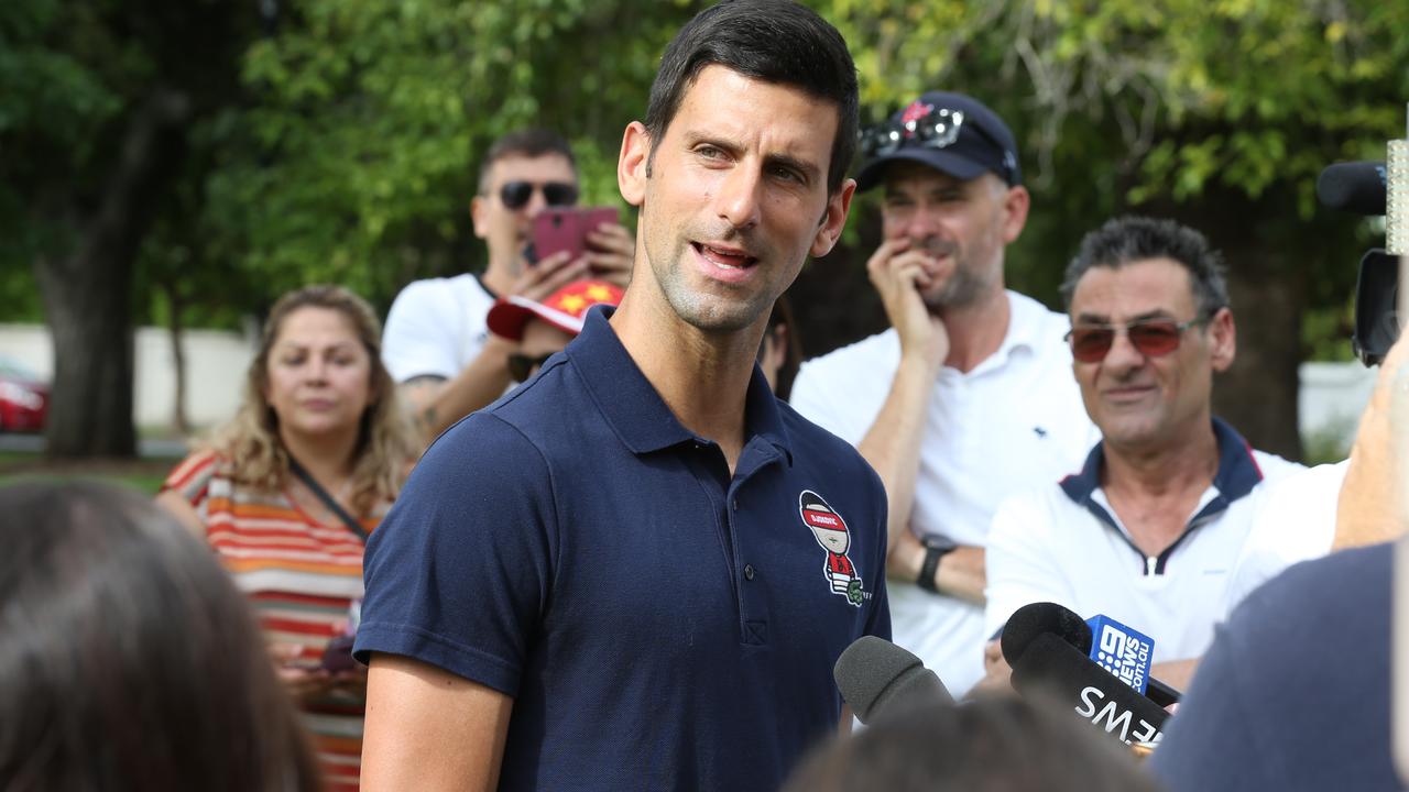 Novak Djokovic mobbed by media and fans in Wellington Square, North Adelaide in 2021. NCA NewsWire / Dean Martin.
